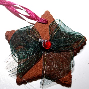 Making a cinnamon star ornament.