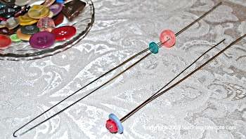 how to string buttons on the floral wire to make button flowers.